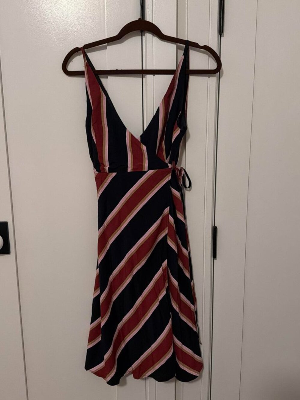 Striped mini dress with diagonal stripes in navy, red, and beige